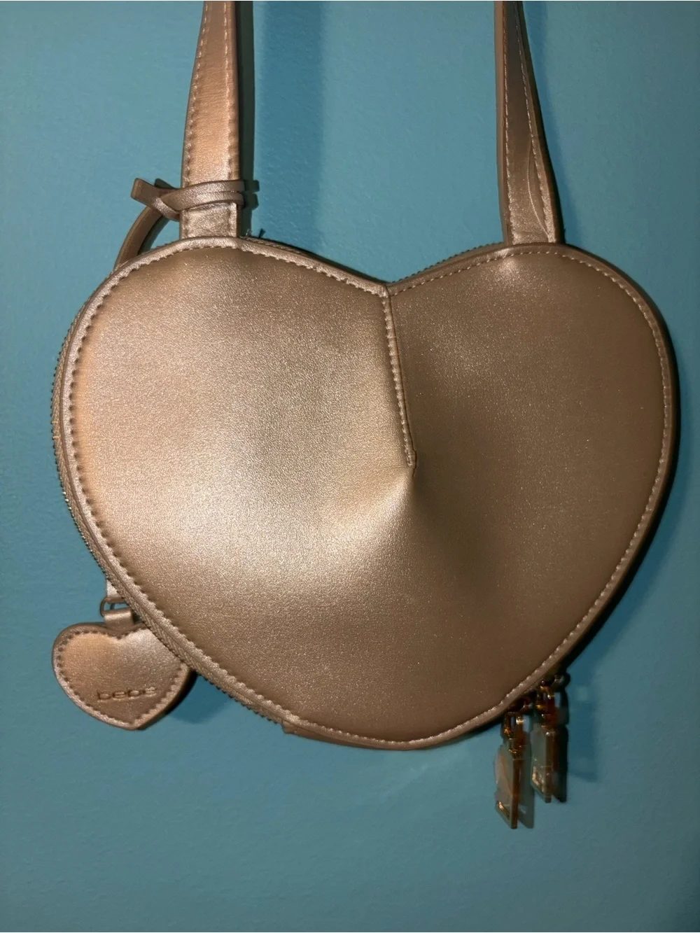 bebe Metallic Champagne Heart Crossbody Bag with Gold Logo